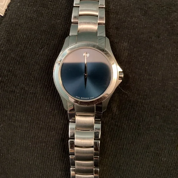 Movado men masino blue, light ware on bezel crystal is in great shape watch